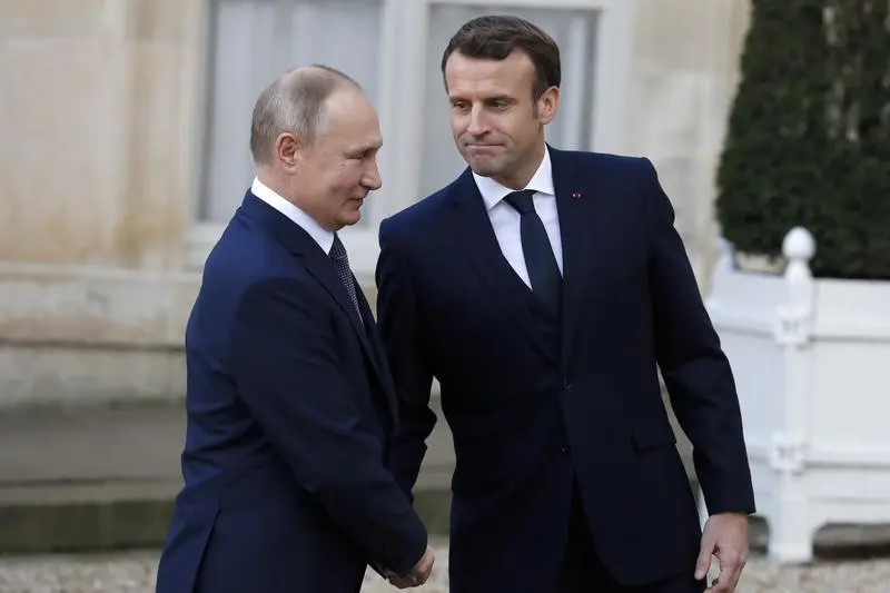 Vladimir Putin y Emmanuel Macron en París, en 2019