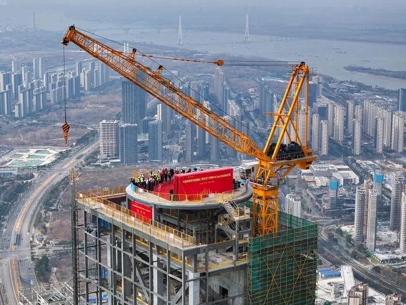 NANJING, Jan. 16, 2024  -- An aerial drone photo taken on Jan. 16, 2024 shows the construction site of the second-phase project (east section) of the Nanjing Financial City in Nanjing, east China's Jiangsu Province. The main structure of the second-phase project (east section) of the Nanjing Financial City was capped on Tuesday. With a gross floor area of around 429,000 square meters, the project is designed as an architectural complex comprising officing, hospitality, housing and commercial facilities.,Image: 837596210, License: Rights-managed, Restrictions: , Model Release: no, Credit line: Li Bo / Xinhua News / ContactoPhoto