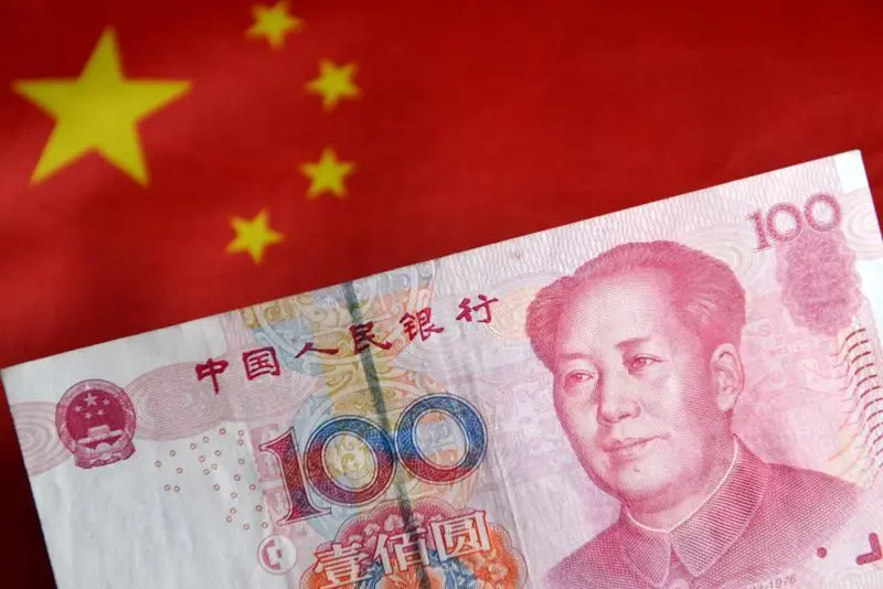 July 29, 2023, China: In this photo illustration, a banknote of 100 RMB cash is displayed with the Chinese flag in the background.,Image: 792828005, License: Rights-managed, Restrictions: , Model Release: no, Credit line: Sheldon Cooper / Zuma Press / ContactoPhoto