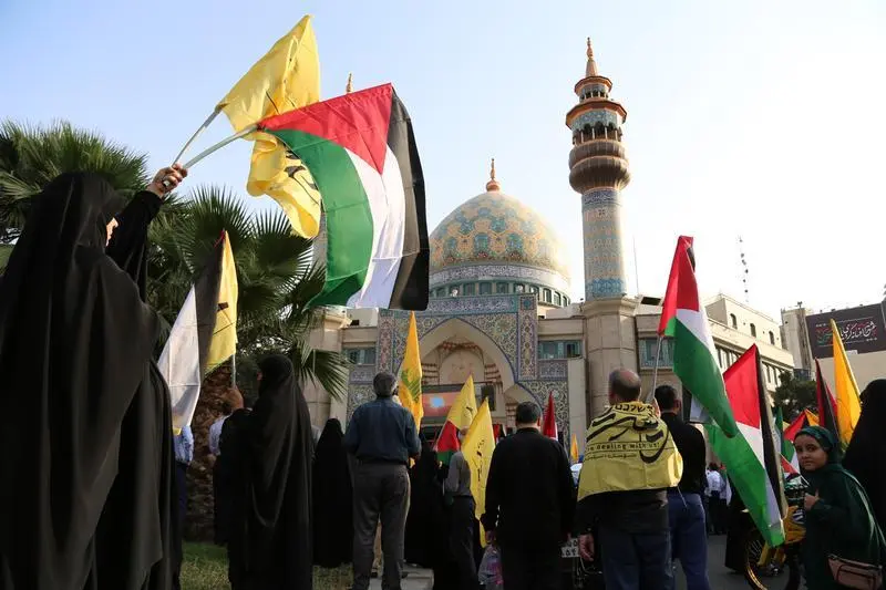 July 31, 2024, Tehran, Iran: Iranian women wave Palestine and Hezbollah flags as they take part in a protest following the death of Hamas political leader Ismail Haniyeh at Palestine Square in downtown Tehran. On July 31, 2024, Ismail Haniyeh and one of his bodyguards were reportedly targeted and killed in Tehran. Hamas stated that Haniyeh, its political leader, was killed in an Israeli strike in Iran after attending the inauguration of the country's new president and vowed a response.,Image: 894640630, License: Rights-managed, Restrictions: , Model Release: no, Credit line: Rouzbeh Fouladi / Zuma Press / ContactoPhoto