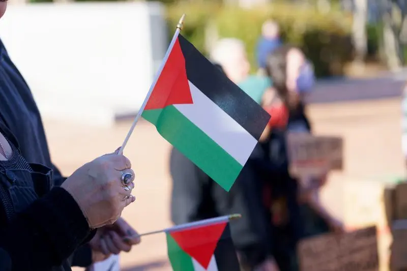 March 2, 2024, Greensboro, North Carolina, USA: A protestor holds a Palestinian flag during a demonstration in downtown Greensboro, NC.,Image: 853445169, License: Rights-managed, Restrictions: , Model Release: no, Credit line: Josh Brown / Zuma Press / ContactoPhoto
