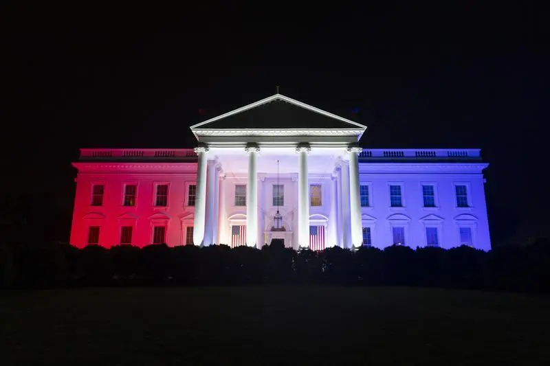 Red, white and blue lanterns and lights are seen on the North Portico of the White House during the Fourth of July Celebration, Thursday, July 4, 2024. 
(Official White House Photo by Oliver Contreras)