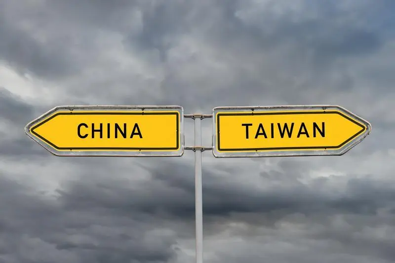 July 11, 2024, Frankfurt Am Main, Hesse, Germany: PHOTOMONTAGE: The conflict between China and Taiwan symbolized by two signs pointing in opposite directions on July 11, 2024. This depiction represents the ongoing tensions and the complex relationship between the two regions. China views Taiwan as a renegade province, while Taiwan sees itself as an independent state. The conflict has geopolitical implications and affects the relations between the US, China, and other countries.,Image: 889081199, License: Rights-managed, Restrictions: * Germany Rights Out *, Model Release: no, Credit line: Maik Meyer / Zuma Press / ContactoPhoto