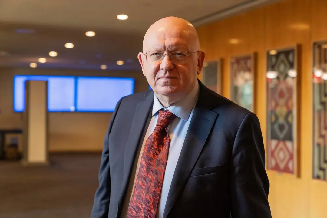 Russian Ambassador Vassily Nebenzia passing through photo exhibition on Holocaust at UN Headquarters in New York on January 27, 2025