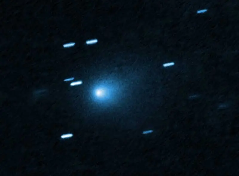 The Hubble Space Telescope captured this image of interstellar object 3I/ATLAS on July 21, 2025. It was the sharpest image yet of the object, acquired when the object was 277 million miles (446 million km) from Earth. This object is now generally believed to be a comet by most astronomers. In this image, a comet-like, teardrop-shaped cocoon of dust can be seen coming off its solid, presumably icy nucleus. Image via NASA/ ESA/ D. Jewitt (UCLA); Image Processing: J. DePasquale (STScI).