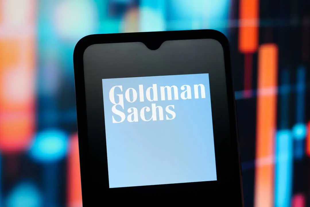 In this photo illustration, the Goldman Sachs (GS) logo is seen displayed on a smartphone screen