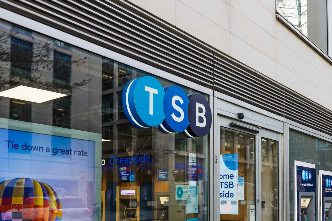 Exterior view of TSB bank branch with bright logo and glass front in a busy urban city environment. London, UK, 29 March 2024