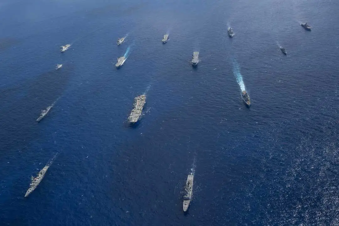 250720-N-TW227-1445 CORAL SEA (July 20, 2025) U.S. Navy ships from the America Strike Group, led by the forward-deployed amphibious assault ship USS America (LHA 6), sail in formation with Royal Australian Navy, Republic of Korea Navy, Royal New Zealand Navy, French Navy and Japan Maritime Self-Defense Force as part of Talisman Sabre 25, July 20. Talisman Sabre is the largest bilateral military exercise between Australia and the United States advancing a free and open Indo-Pacific by strengthening relationships and interoperability among key allies and partners, while enhancing our collective capabilities to respond to a wide array of potential security concerns. (U.S. Navy photo by Mass Communication Specialist 3rd Class Kenneth Melseth)