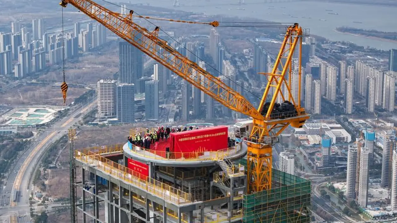 NANJING, Jan. 16, 2024  -- An aerial drone photo taken on Jan. 16, 2024 shows the construction site of the second-phase project (east section) of the Nanjing Financial City in Nanjing, east China's Jiangsu Province. The main structure of the second-phase project (east section) of the Nanjing Financial City was capped on Tuesday. With a gross floor area of around 429,000 square meters, the project is designed as an architectural complex comprising officing, hospitality, housing and commercial facilities.,Image: 837596210, License: Rights-managed, Restrictions: , Model Release: no, Credit line: Li Bo / Xinhua News / ContactoPhoto