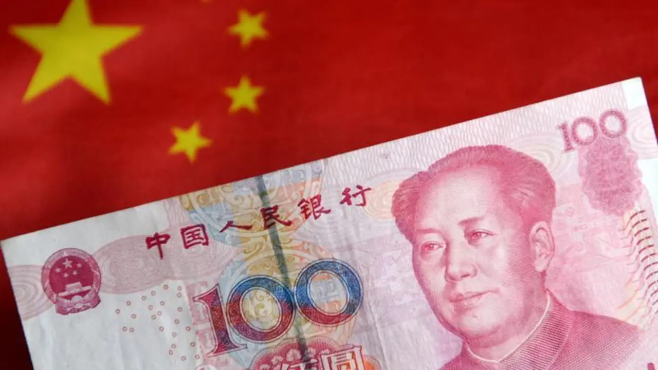 July 29, 2023, China: In this photo illustration, a banknote of 100 RMB cash is displayed with the Chinese flag in the background.,Image: 792828005, License: Rights-managed, Restrictions: , Model Release: no, Credit line: Sheldon Cooper / Zuma Press / ContactoPhoto