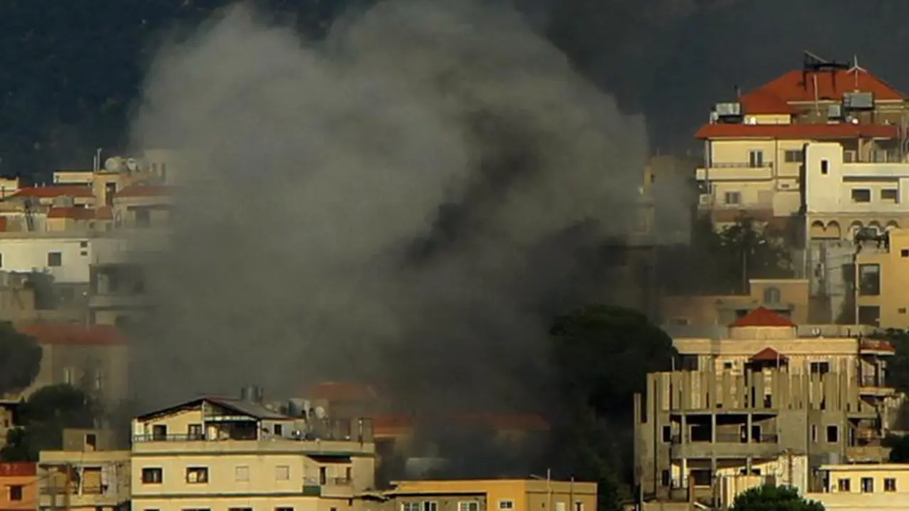 August 23, 2024, Qliyaa, Qlyiaa, Lebanon: Heavy smoke from an Israeli shelling billows from between houses in the Lebanese southern border town of Khiam. Seven pro-Iranian Hezbollah militants and a child were killed in Israeli strikes across south Lebanon as armed group Hezbollah responded with artillery rounds and rockets across the border. The Israeli military has been trading fire with Hezbollah across Lebanon's southern border in parallel with the Gaza war, with hostilities ramping up recently amid fears that a full-scale regional war could erupt.,Image: 901014895, License: Rights-managed, Restrictions: , Model Release: no, Credit line: Marwan Naamani / Zuma Press / ContactoPhoto