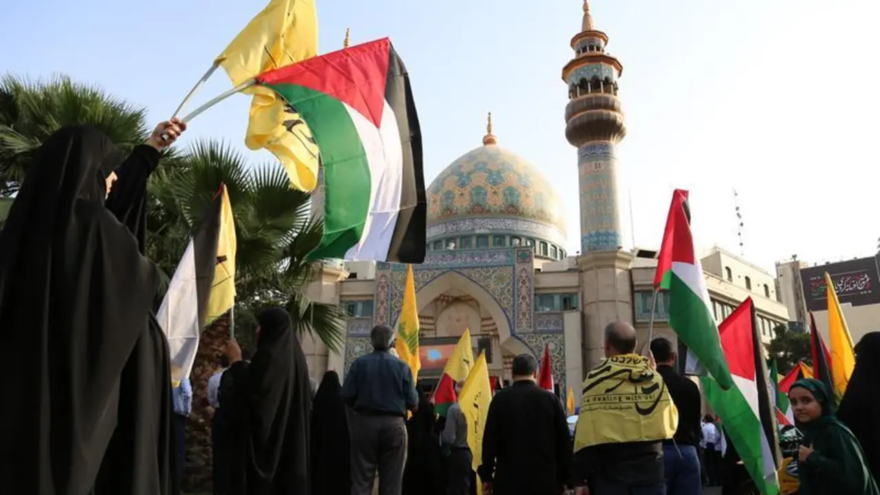 July 31, 2024, Tehran, Iran: Iranian women wave Palestine and Hezbollah flags as they take part in a protest following the death of Hamas political leader Ismail Haniyeh at Palestine Square in downtown Tehran. On July 31, 2024, Ismail Haniyeh and one of his bodyguards were reportedly targeted and killed in Tehran. Hamas stated that Haniyeh, its political leader, was killed in an Israeli strike in Iran after attending the inauguration of the country's new president and vowed a response.,Image: 894640630, License: Rights-managed, Restrictions: , Model Release: no, Credit line: Rouzbeh Fouladi / Zuma Press / ContactoPhoto