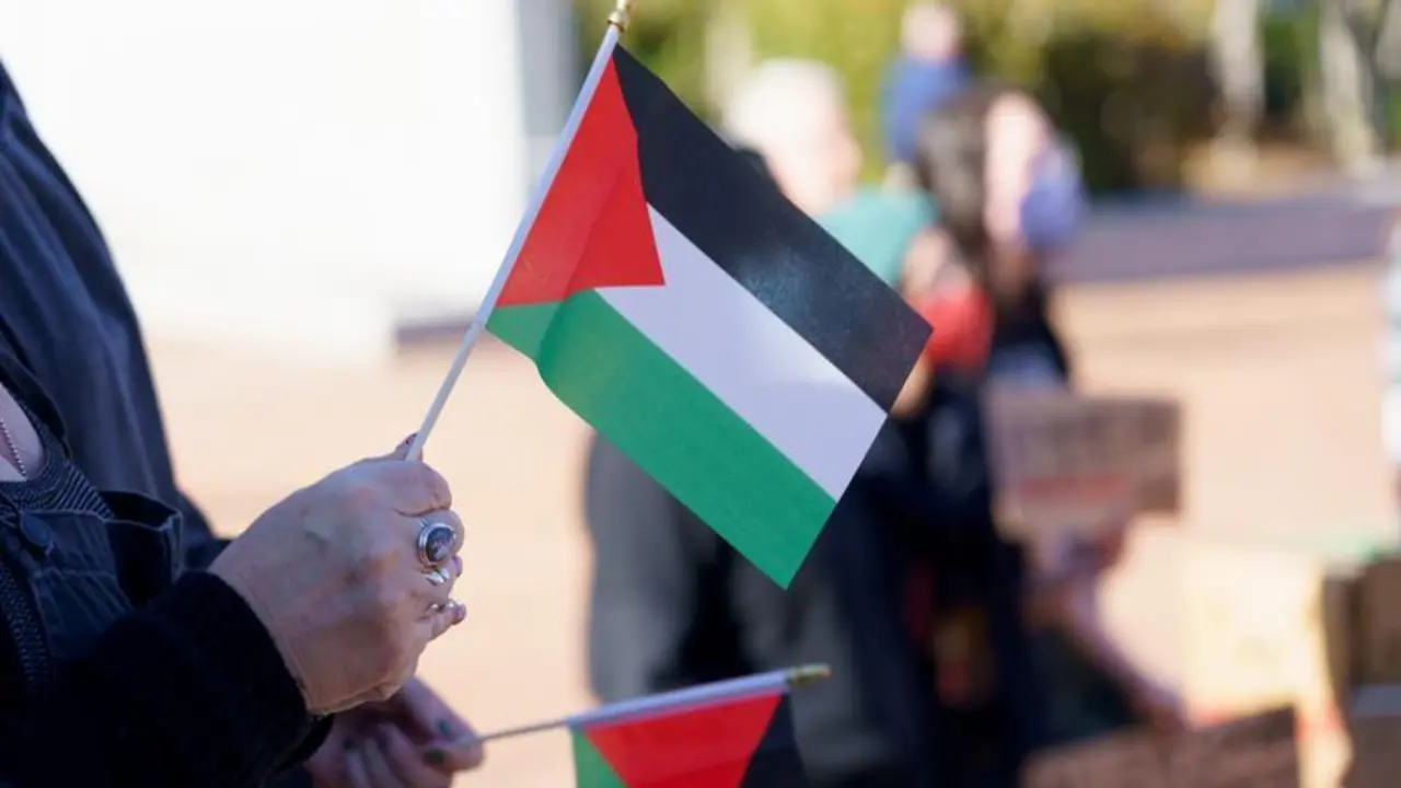 March 2, 2024, Greensboro, North Carolina, USA: A protestor holds a Palestinian flag during a demonstration in downtown Greensboro, NC.,Image: 853445169, License: Rights-managed, Restrictions: , Model Release: no, Credit line: Josh Brown / Zuma Press / ContactoPhoto