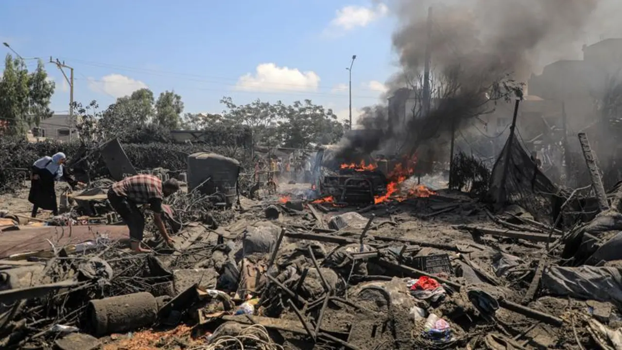 GAZA, July 13, 2024  -- This photo taken on July 13, 2024 shows destroyed buildings and vehicles following an Israeli airstrike in the Mawasi area of the southern Gaza Strip city of Khan Younis. At least 71 Palestinians were killed and 289 others injured on Saturday by an Israeli airstrike that attacked tents of displaced people in the Mawasi area of the Khan Younis city in the south of Gaza, the Gaza health authorities said.,Image: 889455340, License: Rights-managed, Restrictions: , Model Release: no, Credit line: Rizek Abdeljawad / Xinhua News / ContactoPhoto