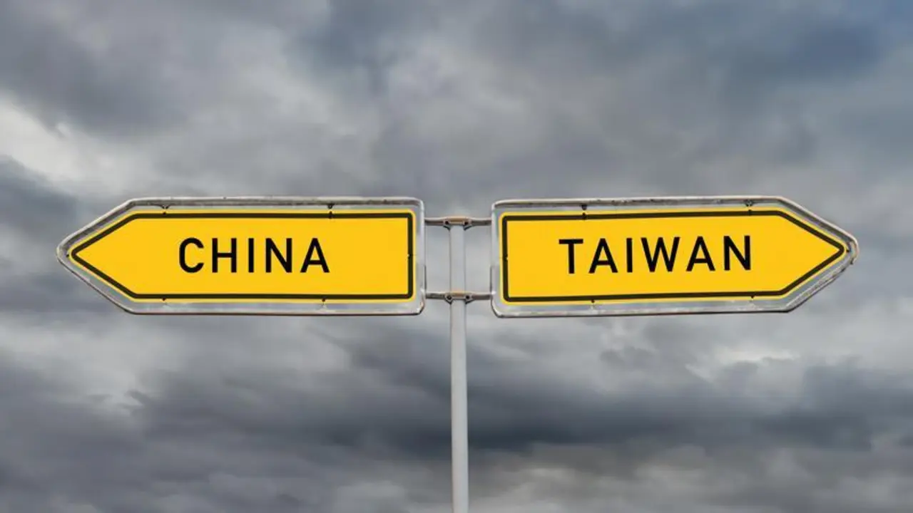 July 11, 2024, Frankfurt Am Main, Hesse, Germany: PHOTOMONTAGE: The conflict between China and Taiwan symbolized by two signs pointing in opposite directions on July 11, 2024. This depiction represents the ongoing tensions and the complex relationship between the two regions. China views Taiwan as a renegade province, while Taiwan sees itself as an independent state. The conflict has geopolitical implications and affects the relations between the US, China, and other countries.,Image: 889081199, License: Rights-managed, Restrictions: * Germany Rights Out *, Model Release: no, Credit line: Maik Meyer / Zuma Press / ContactoPhoto