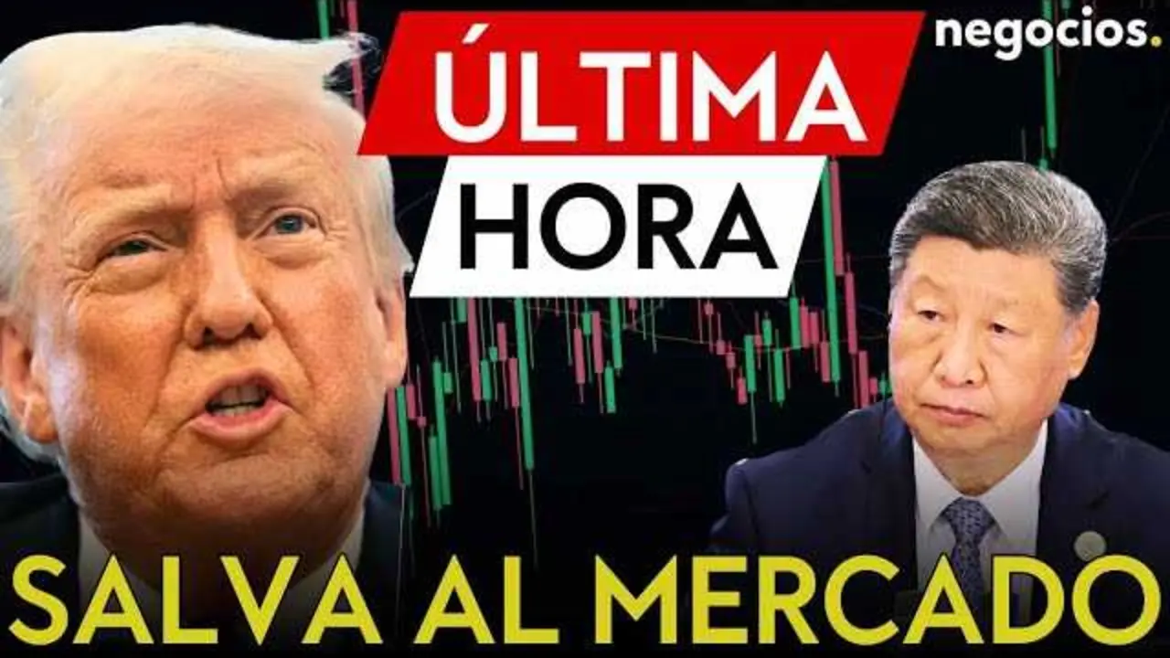 Captura del vídeo de Negocios TV que muestra a Donald Trump en rueda de prensa con gráficos de bolsas en el fondo<br>                        <br>                        <br>                        <br>                      