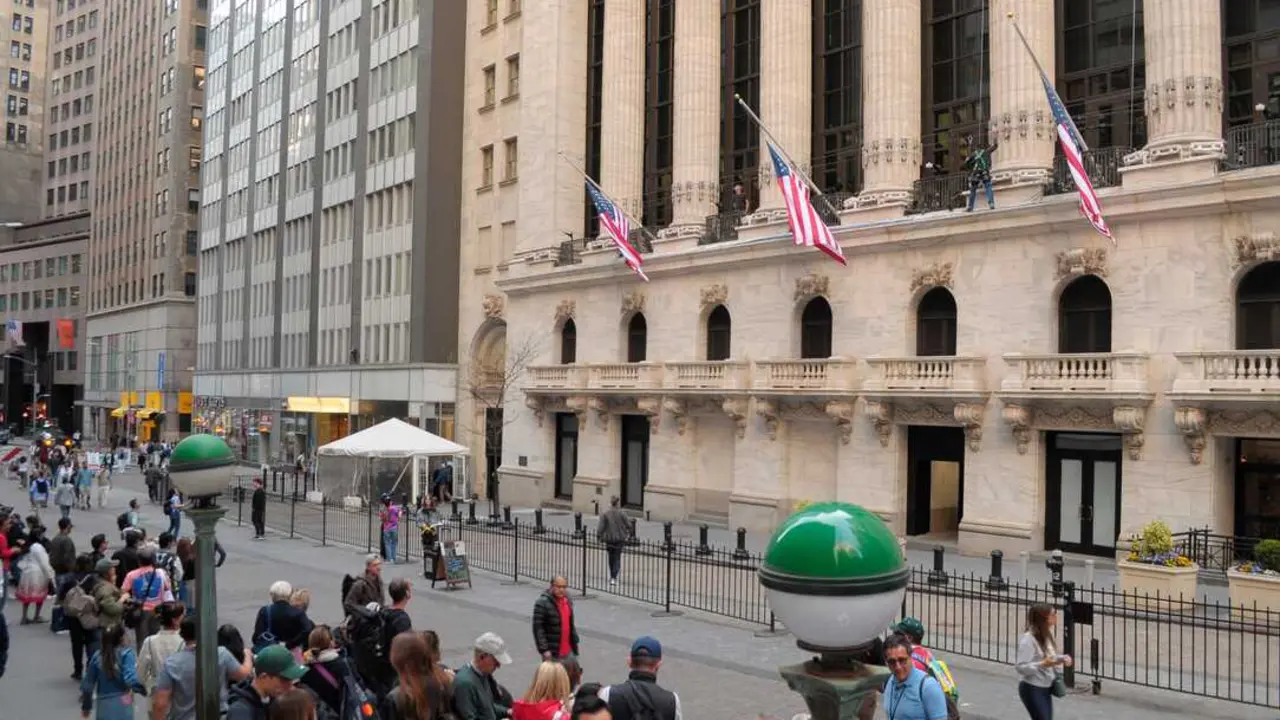 People walk past the New York Stock Exchange in the Financial District in Manhattan, New York City.