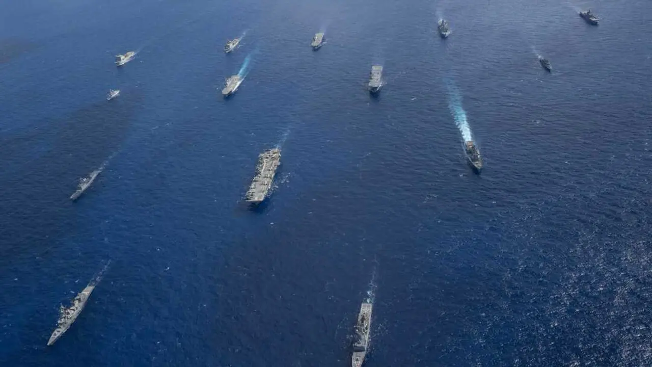 250720-N-TW227-1445 CORAL SEA (July 20, 2025) U.S. Navy ships from the America Strike Group, led by the forward-deployed amphibious assault ship USS America (LHA 6), sail in formation with Royal Australian Navy, Republic of Korea Navy, Royal New Zealand Navy, French Navy and Japan Maritime Self-Defense Force as part of Talisman Sabre 25, July 20. Talisman Sabre is the largest bilateral military exercise between Australia and the United States advancing a free and open Indo-Pacific by strengthening relationships and interoperability among key allies and partners, while enhancing our collective capabilities to respond to a wide array of potential security concerns. (U.S. Navy photo by Mass Communication Specialist 3rd Class Kenneth Melseth)